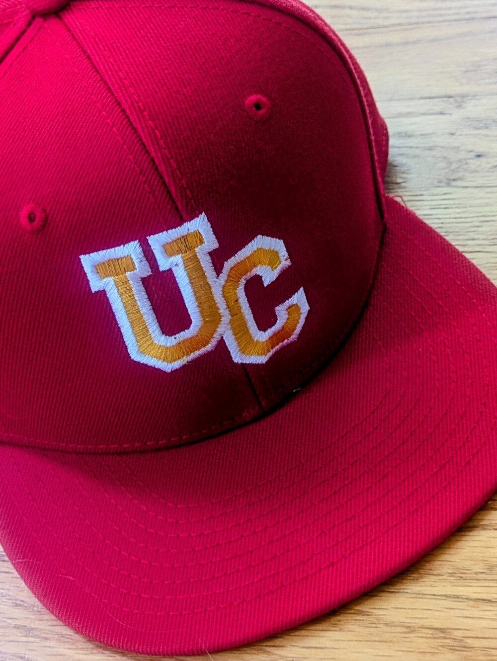 Red Snapback Baseball Cap with White And Gold UC Embroidered Logo